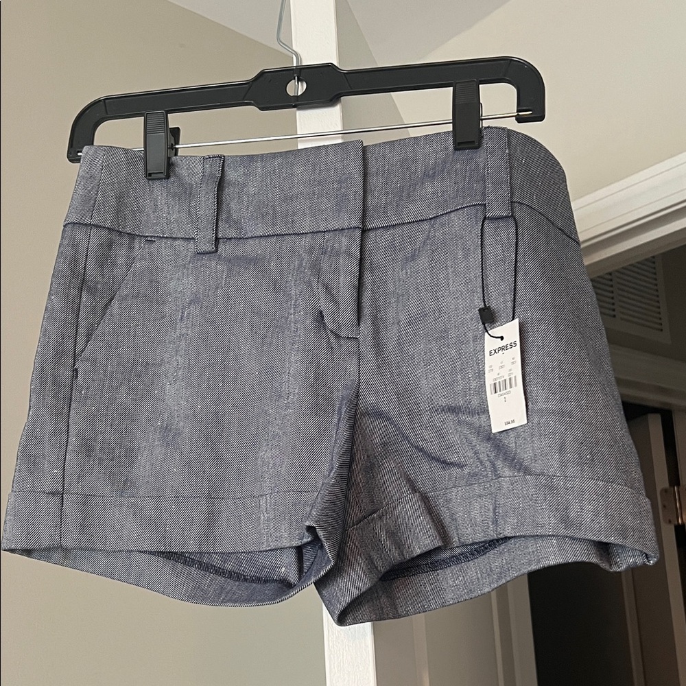 Women’s Express stretch midi mid rise shorts. Size 2. NWT
